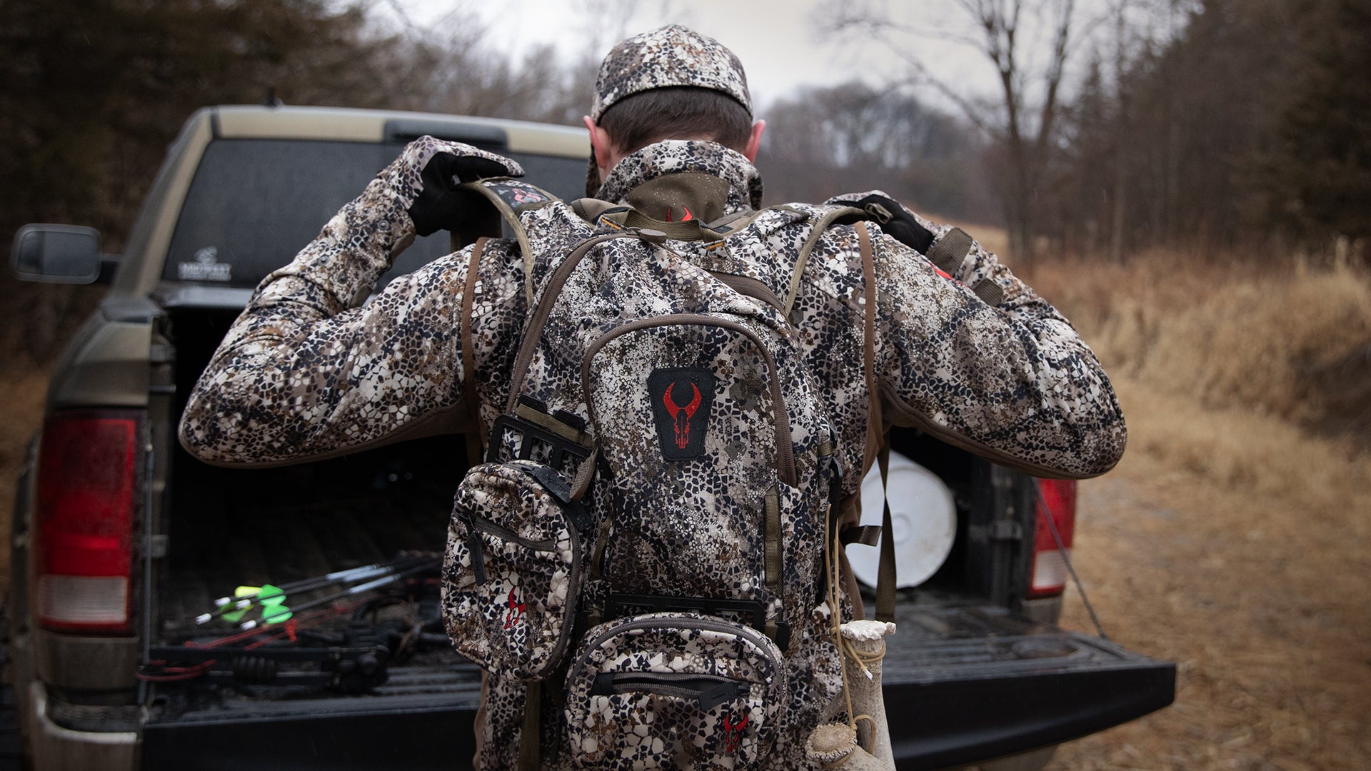 hunter pulling putting on Moonrivers pack