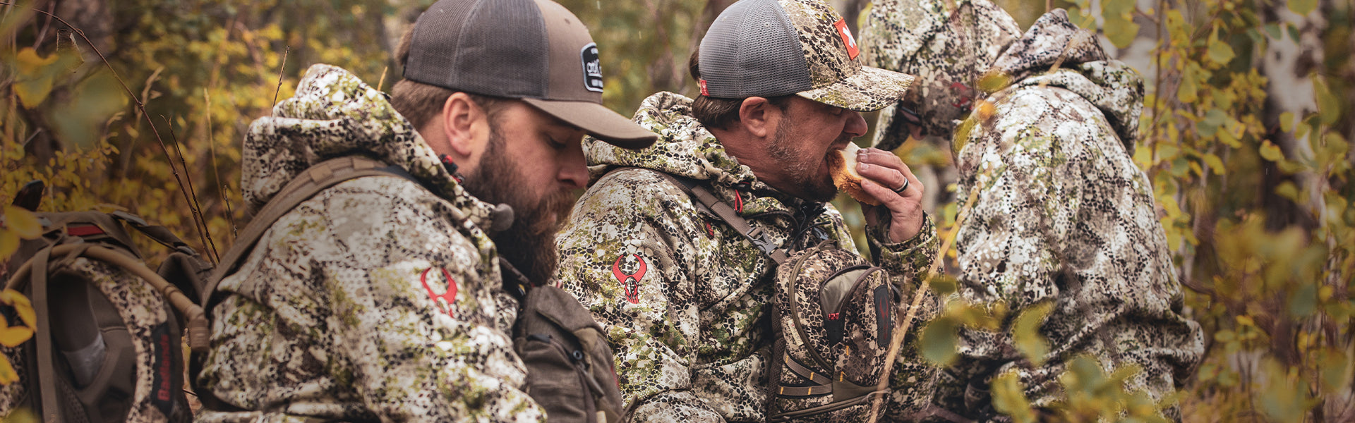 Men eating while hunting