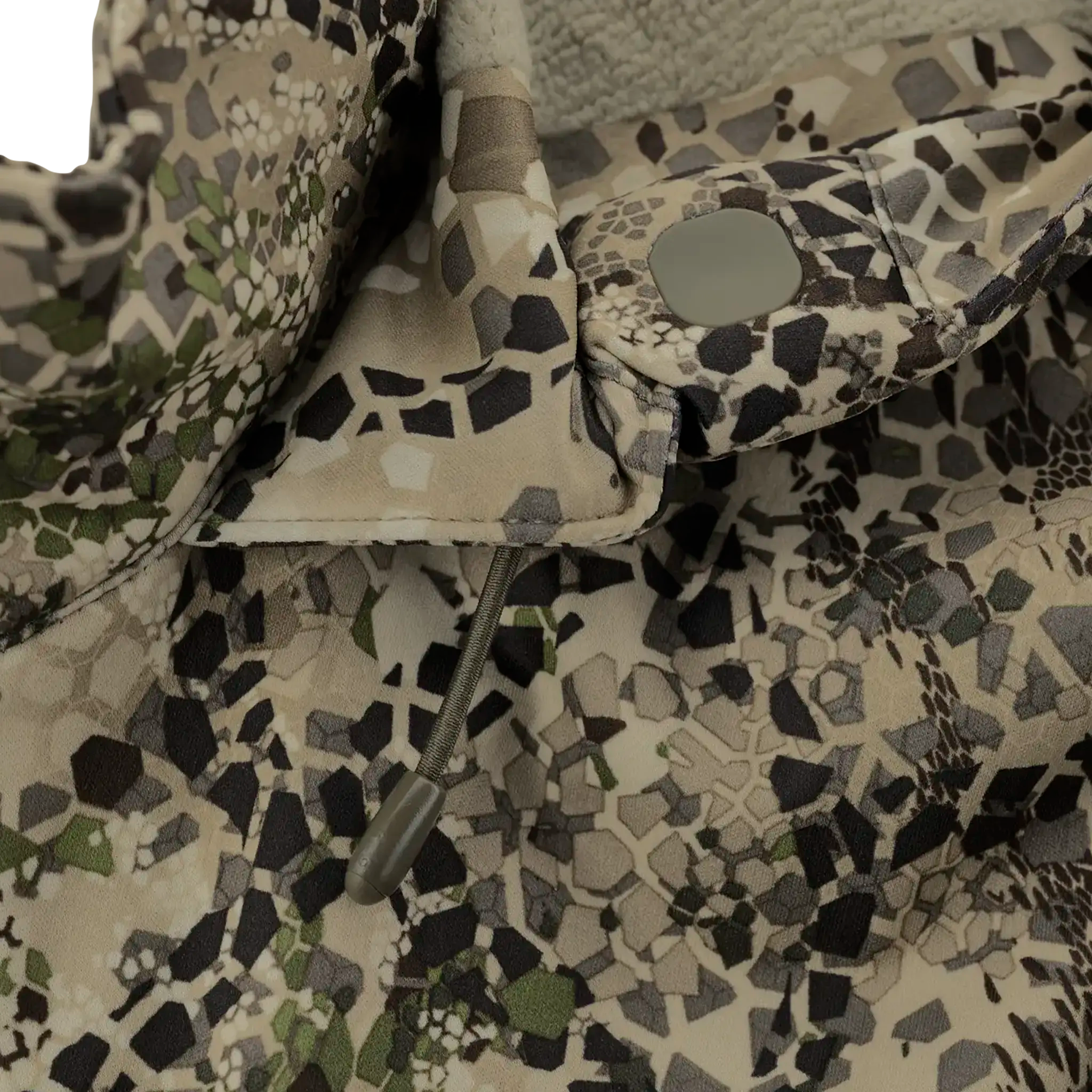 Close-up of a camouflage jacket with a drawstring and snap button, featuring a geometric pattern in earth tones.