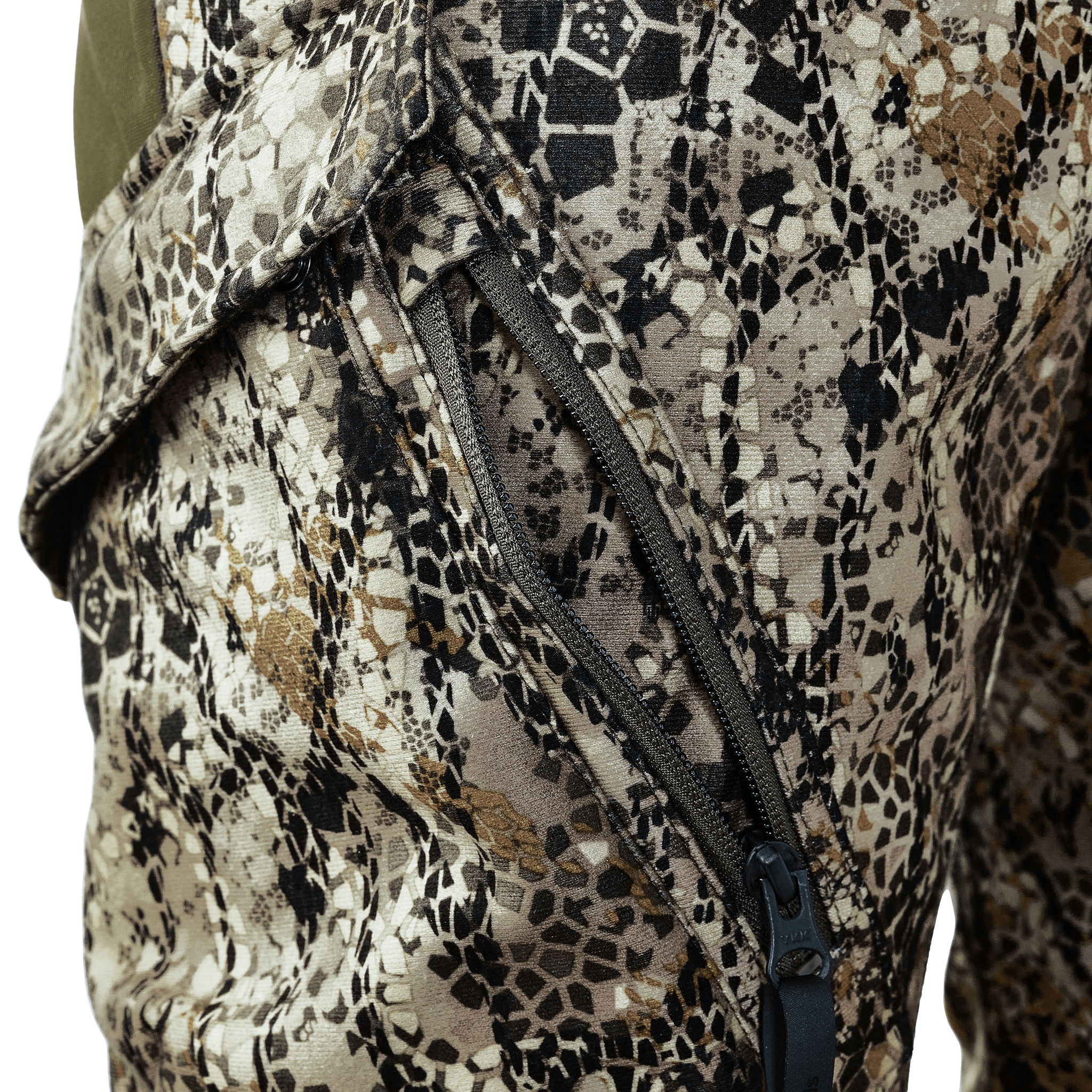 Close-up of camouflage-patterned pants with a zippered pocket, showing textured fabric and detailed stitching.
