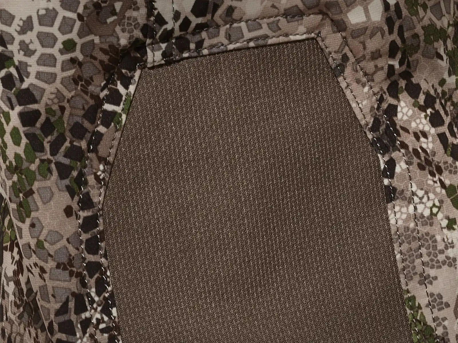 Close-up of Moonrivers camo fabric with reinforced stitching and textured panel; no visible Moonrivers skull logo.