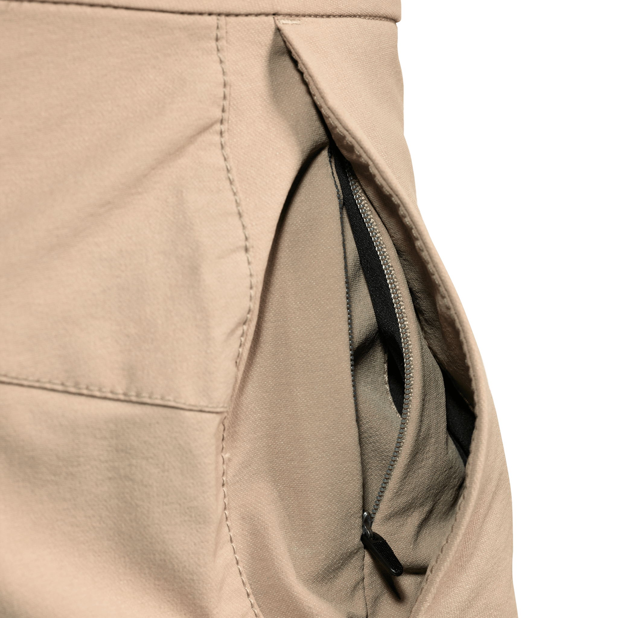 Close-up of a tan Moonrivers pant pocket with an inner zippered compartment for secure storage. No visible logo.