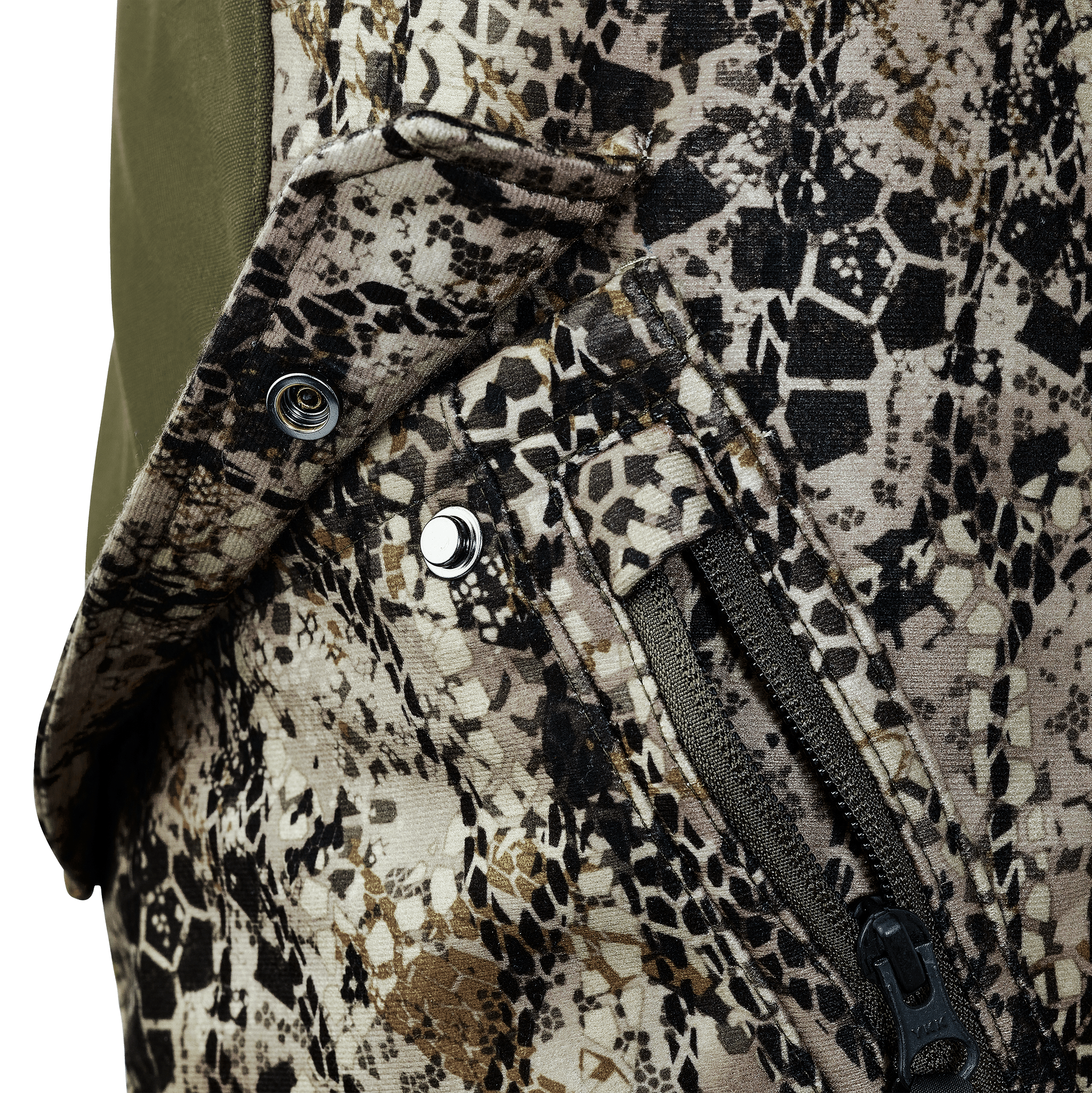 Close-up of camo fabric with a Moonrivers Logo snap, zipper pocket, and textured pattern for outdoor gear.