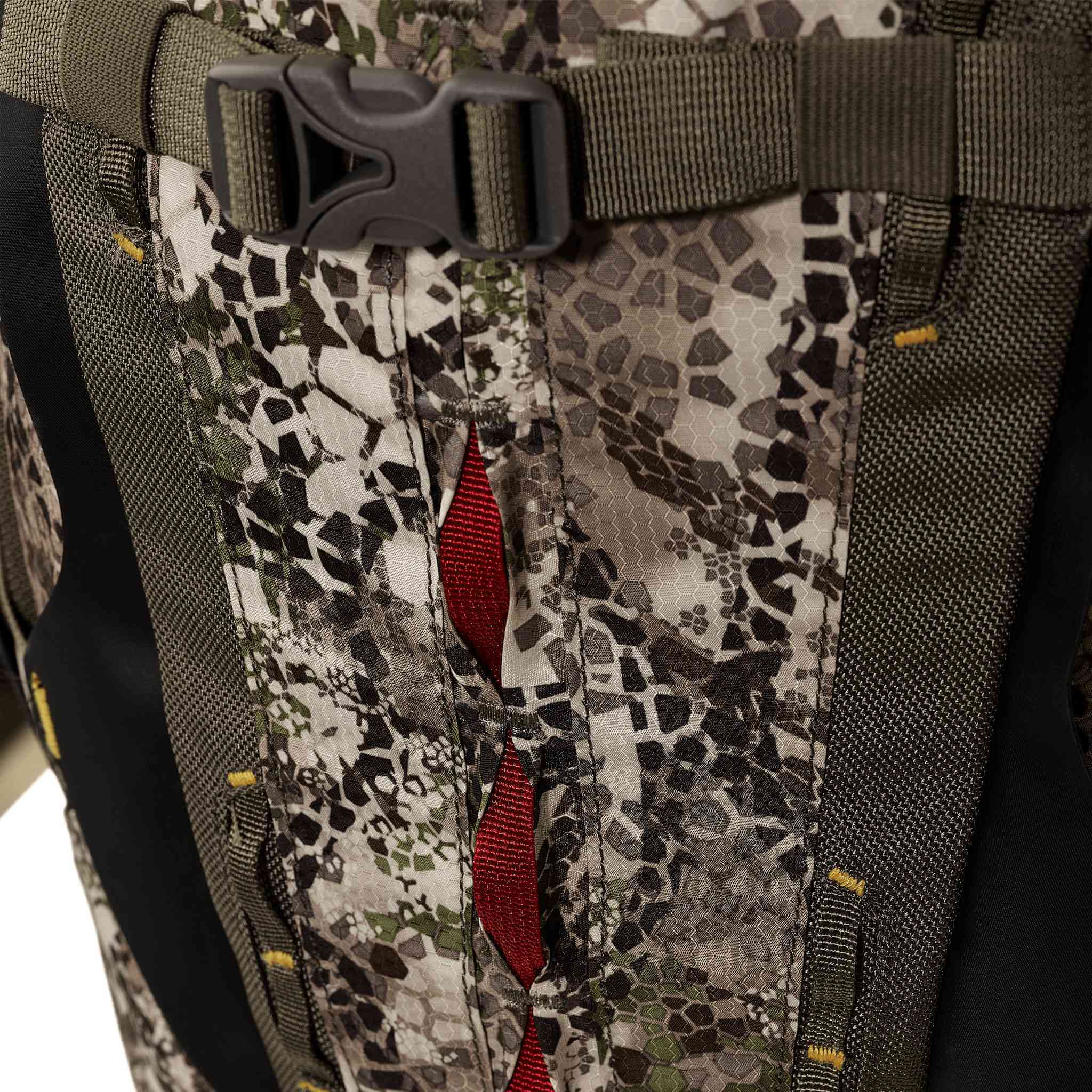 Close-up of a camo-patterned backpack with a buckle and red Moonrivers Logo detail, designed for outdoor use.