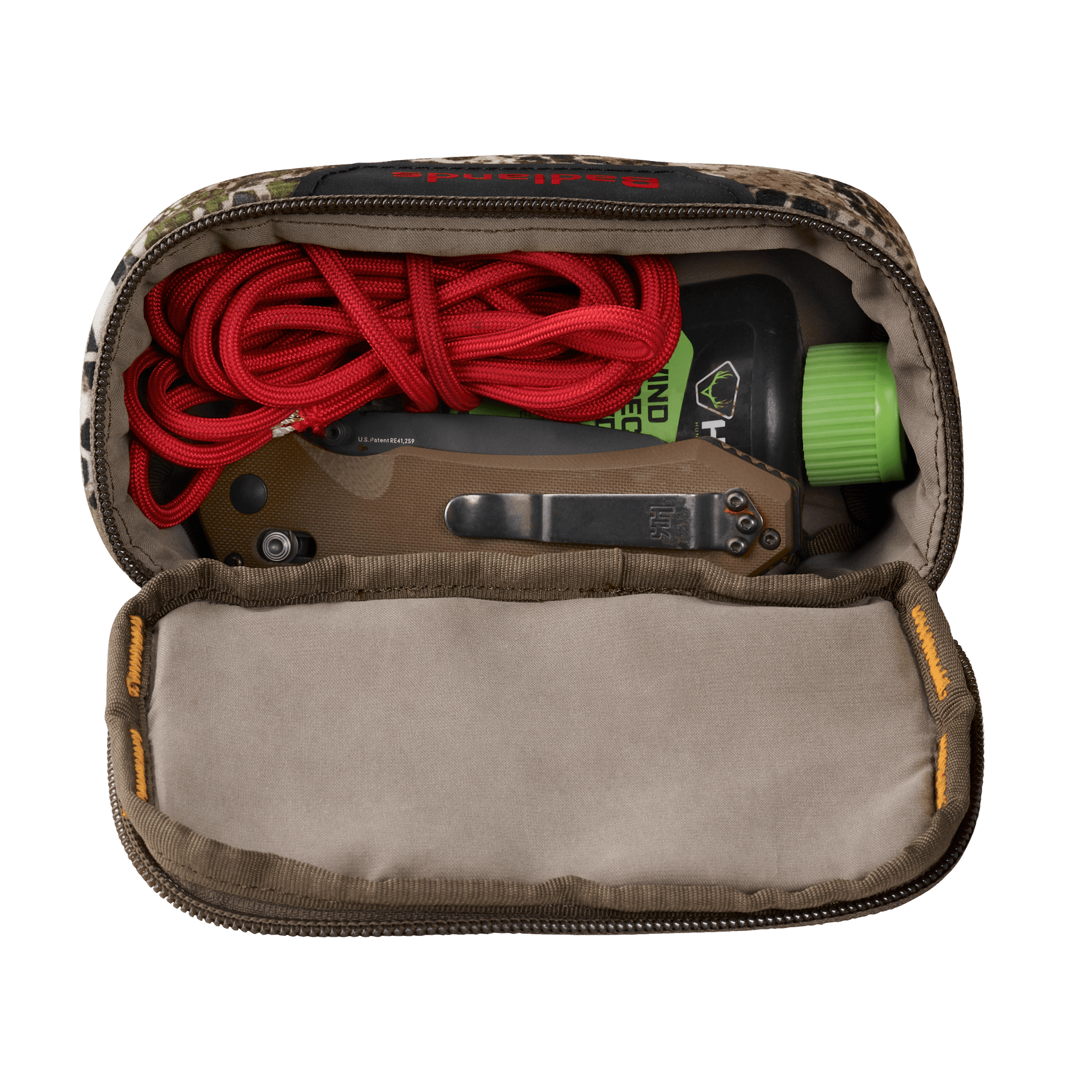 Open camo pouch with red cord, folding knife, and bottle featuring the Moonrivers skull logo, shown from above.