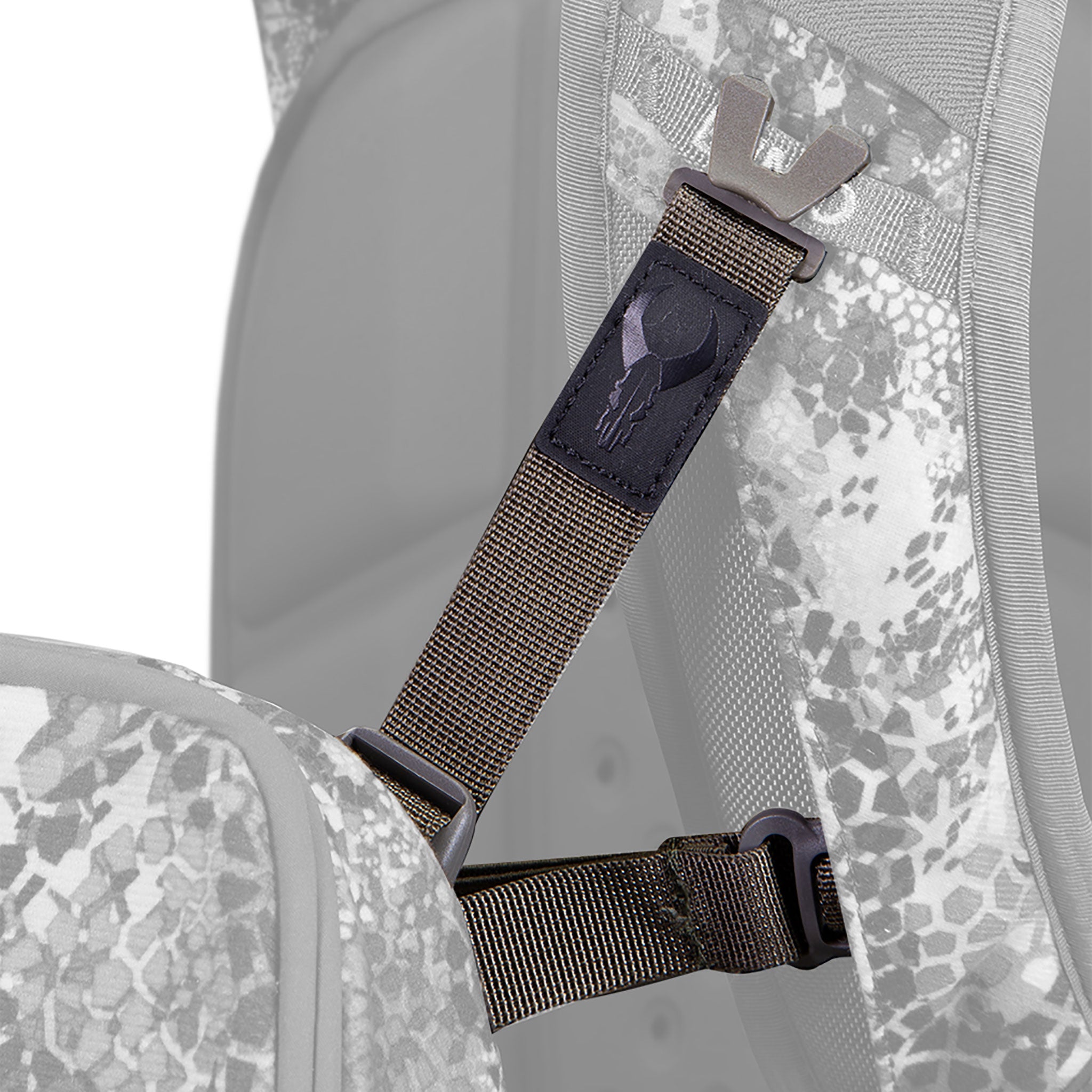 Close-up of a backpack strap with the Moonrivers skull logo, featuring camouflage fabric and adjustable buckle.