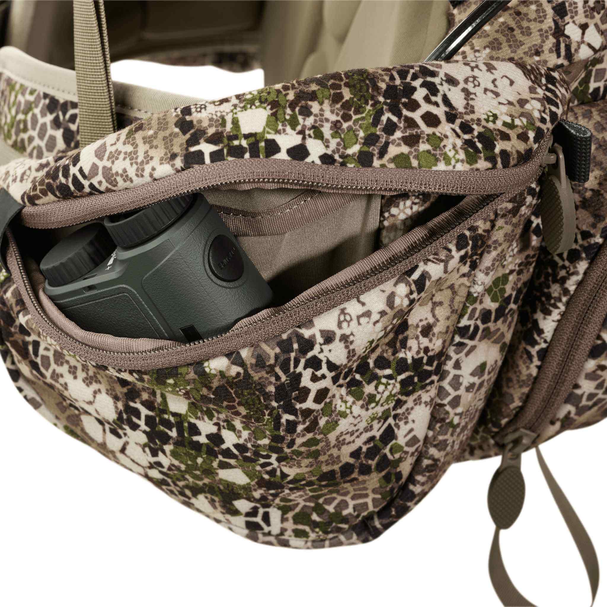 Moonrivers camo pack with open zippered pocket, showing binoculars inside. Moonrivers skull logo visible on the fabric.