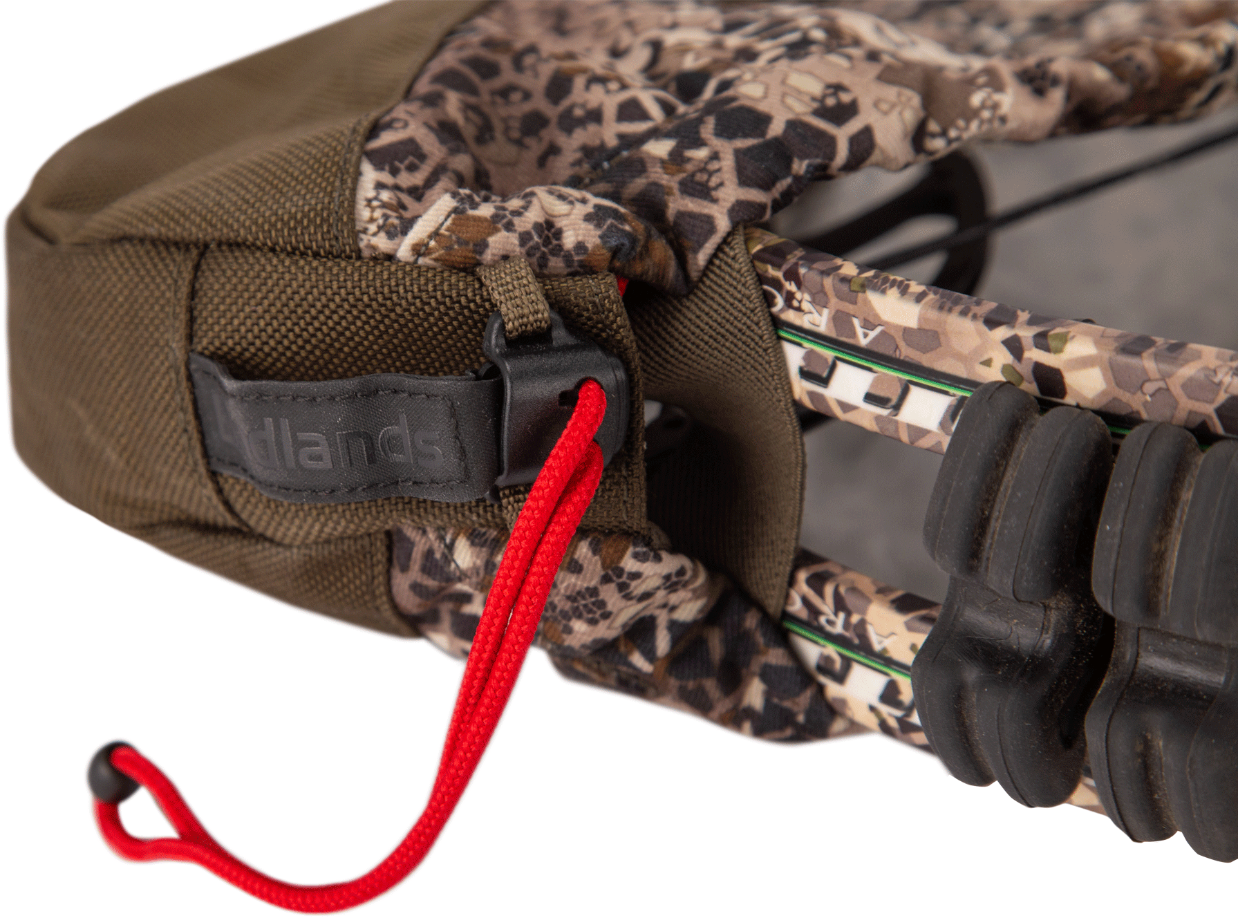 Close-up of a camo Moonrivers bow cover with red drawstring and visible limb dampeners.