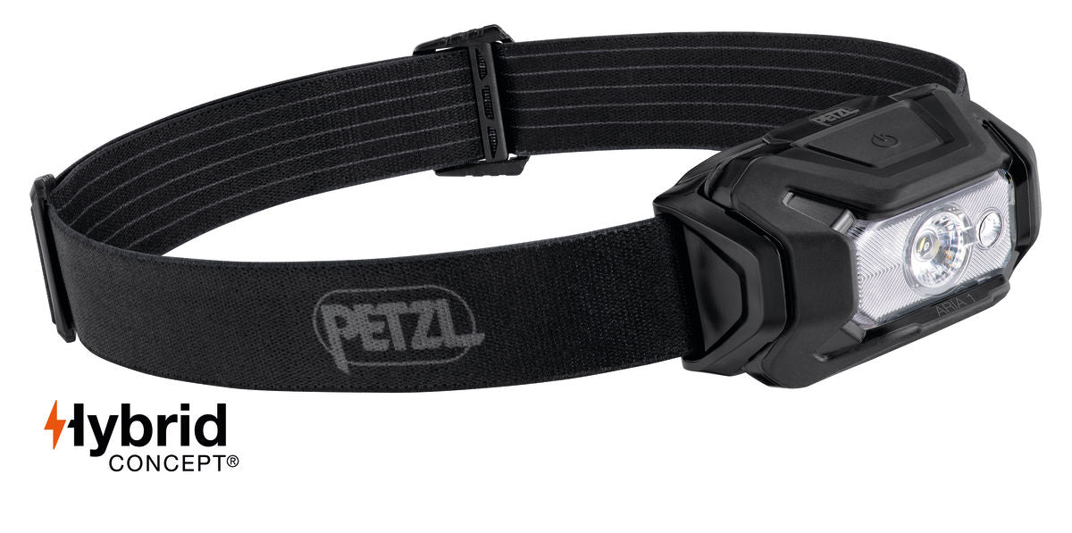 Black Petzl headlamp with adjustable strap, LED lights, and "Hybrid Concept" logo for dual power options.